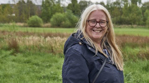 Picture of a woman outside receiving wellbeing support