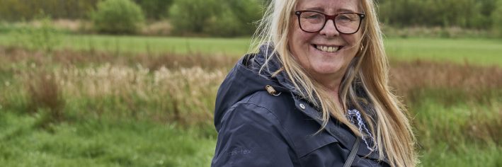 Picture of a woman outside receiving wellbeing support