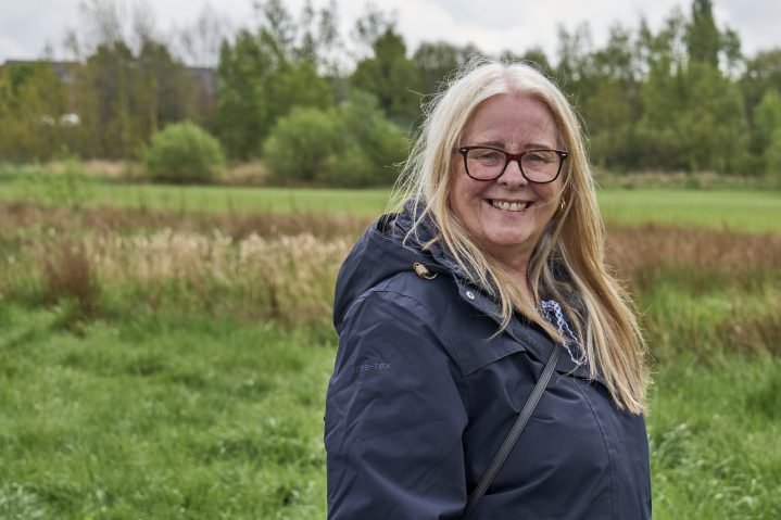 Picture of a woman outside receiving wellbeing support